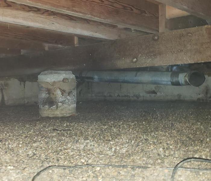 Crawl space after sewage water has been removed and cleaned.