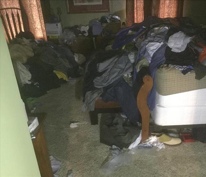 Hoarder's bedroom filled with clothing