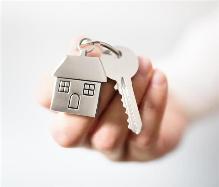 Handing off keys to homeowner